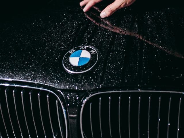 Water beading tightly across a freshly protected car hood